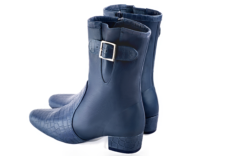 Denim blue women's ankle boots with buckles on the sides. Round toe. Low block heels. Rear view - Florence KOOIJMAN
